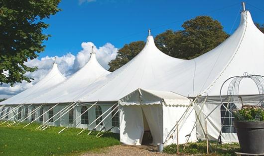 a line of sleek and modern portable restrooms ready for use at an upscale corporate event in Portland